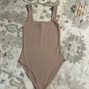 Tan body suit